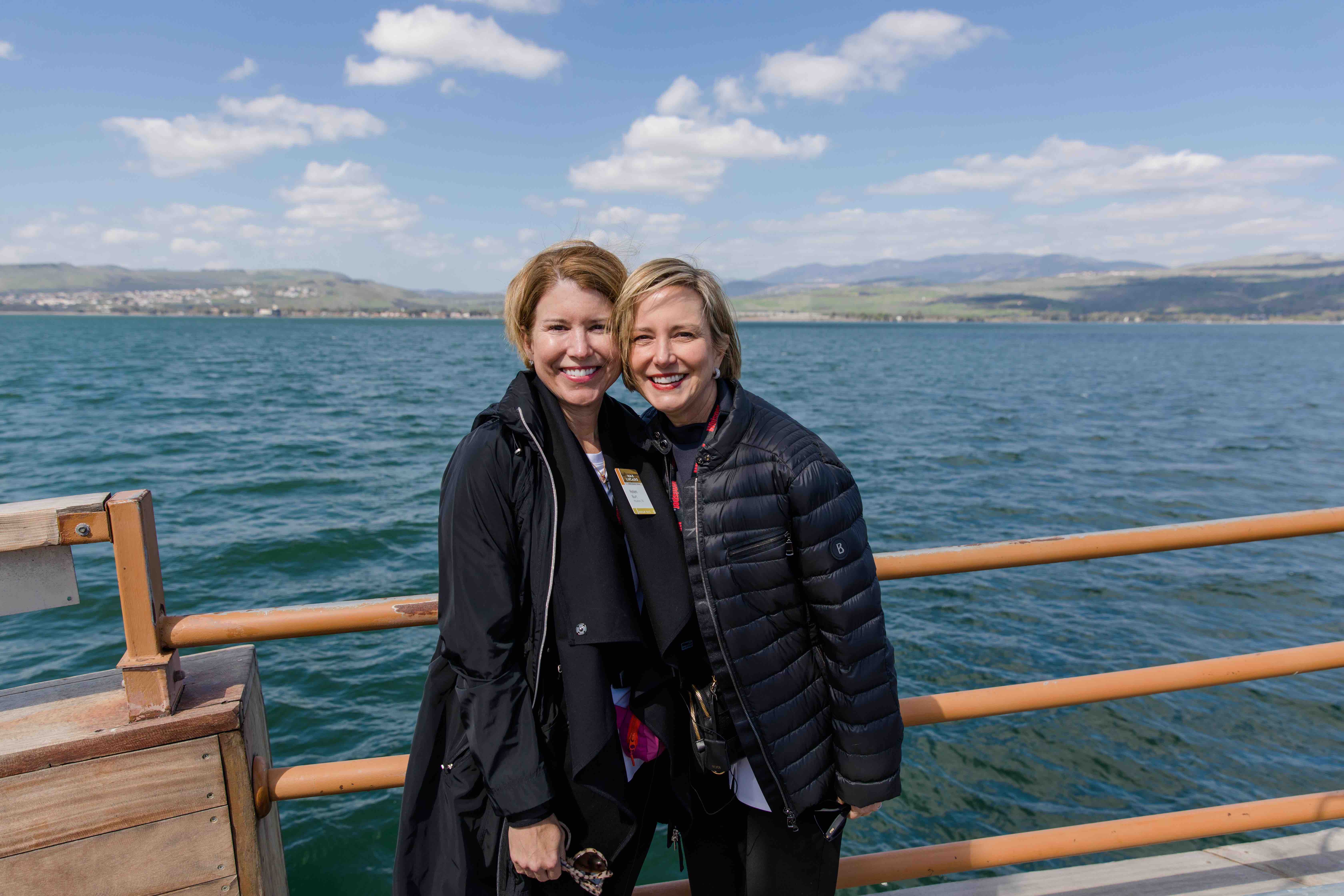 Travelers posing for a picture on a boat in the Sea of Galilee.