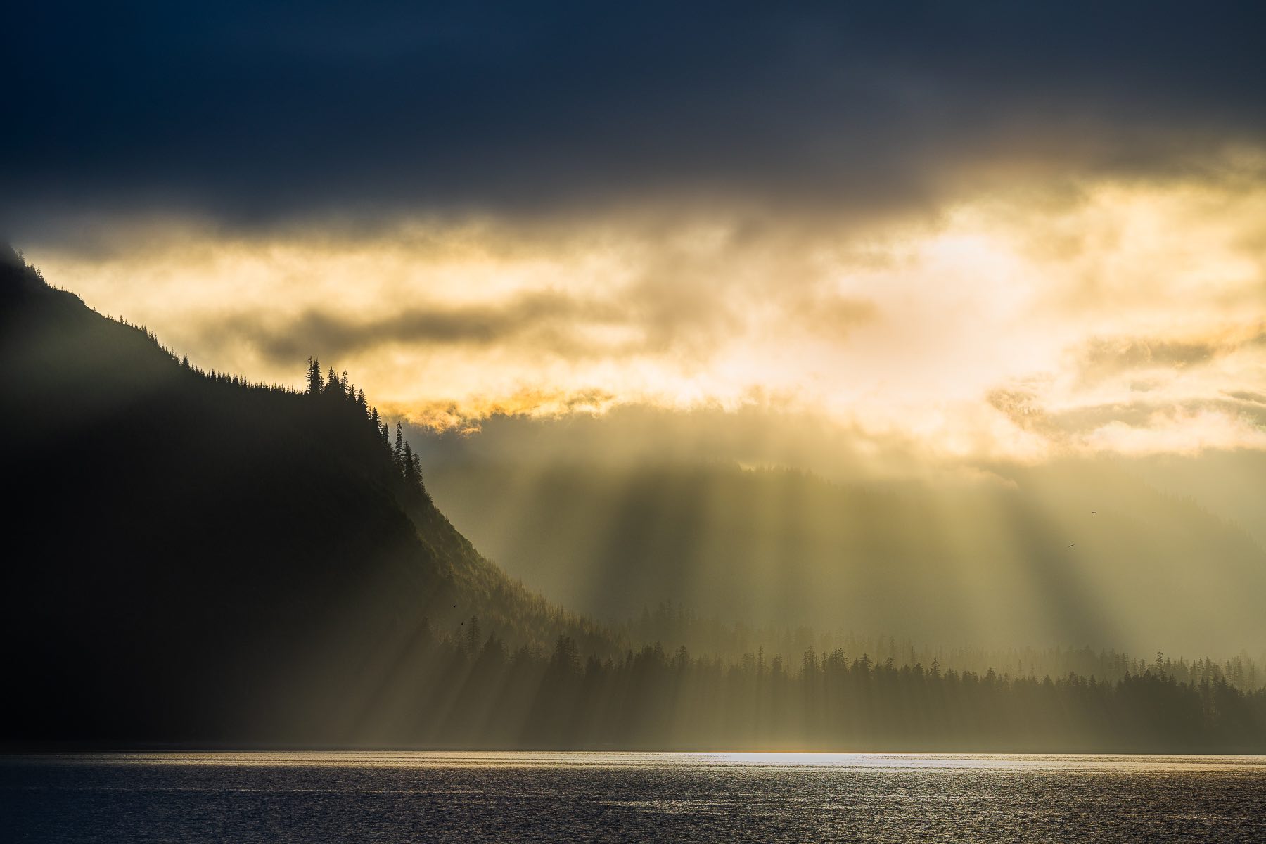 The setting sun over this distant ridgeline at Icy Strait Point.