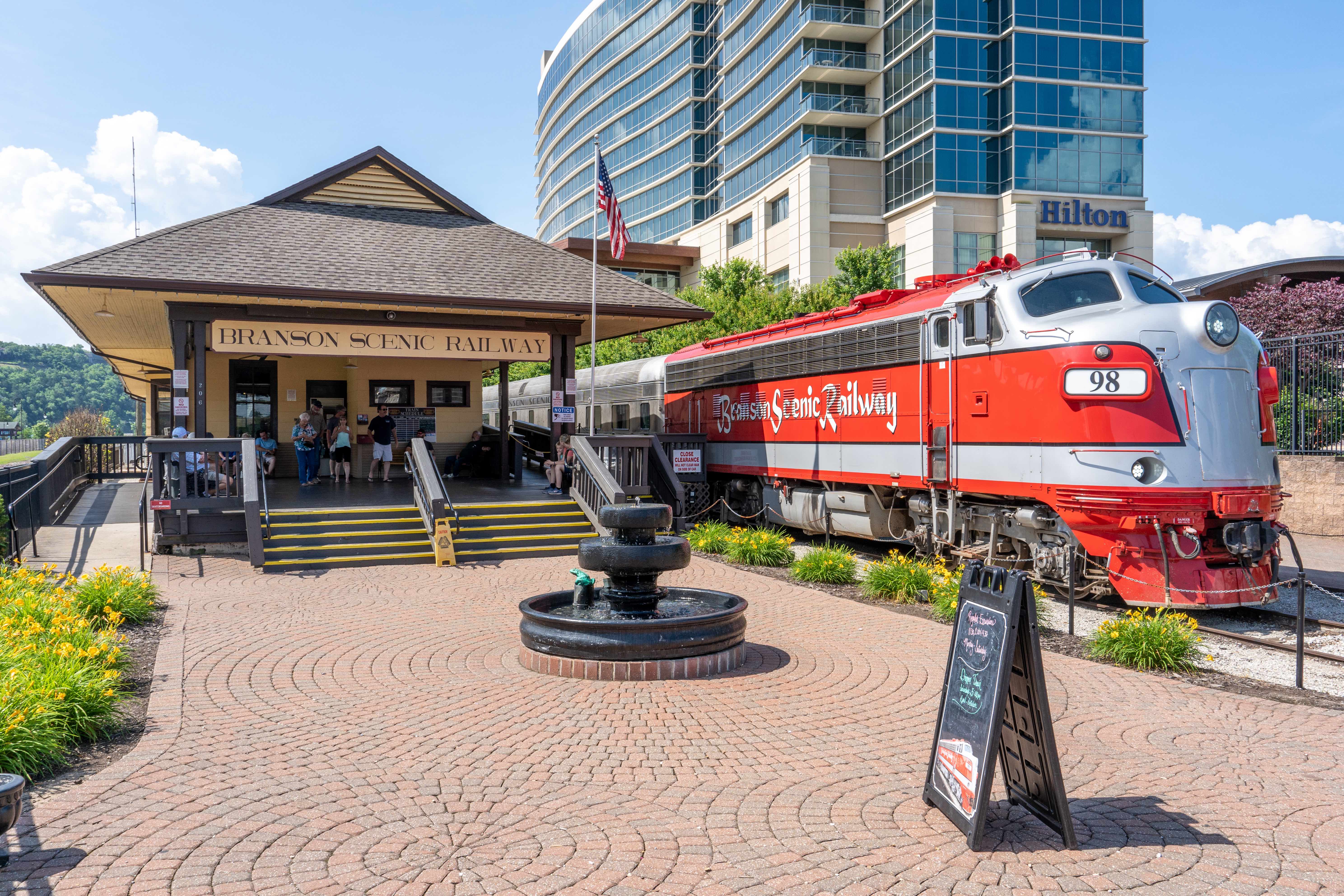 The vintage crimson Branson Scenic Railway train stationed at its depot in Branson, Missouri