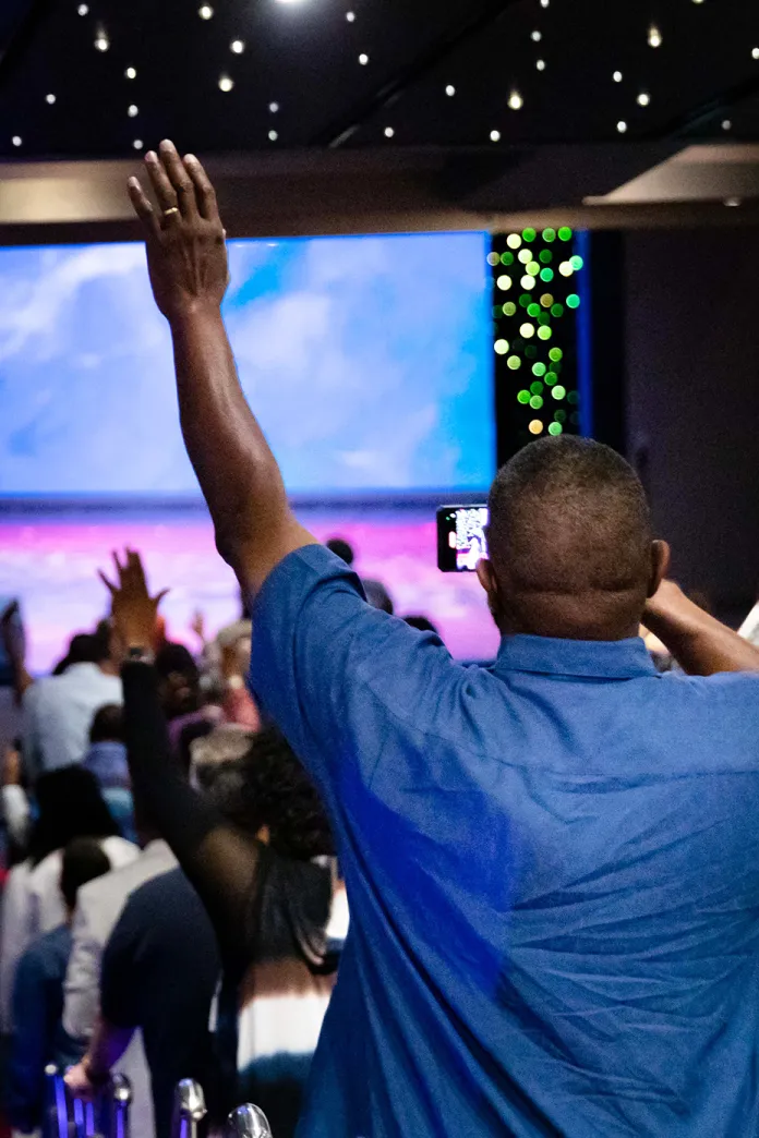 Man lifting his arm during a concert